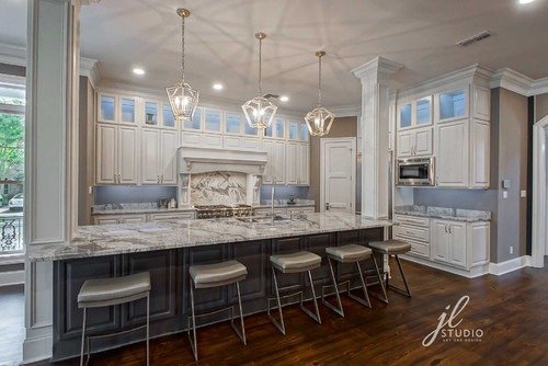 quartz countertops and white cabinets in kithen